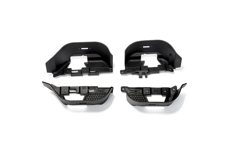 A set of four black plastic RGT inner fender splash guards for an RC crawler, shown from a top-down perspective on a white background.