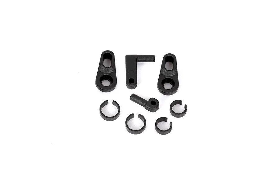 A set of black plastic RGT DIG servo parts including two servo horns, two small linkage arms, and four C-clips on a white background.