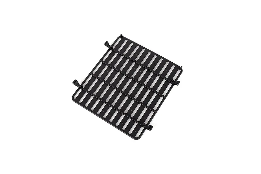 A black plastic RC roof rack accessory for RGT vehicles, shown from a top-down perspective against a white background.