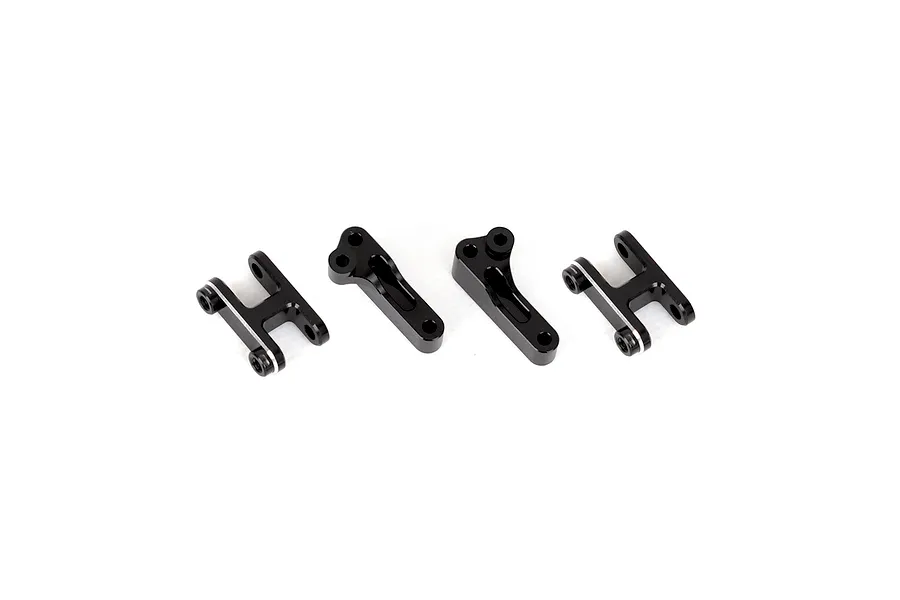 A set of four black anodized aluminium RC shock mounts arranged on a white background.