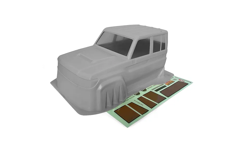 A grey RGT 1/10 scale LC79 Land Commander RC crawler body shell with an included decal sheet on a white background.