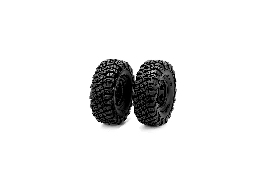 Two black 1/10 scale RC crawler wheels with aggressive tread patterns and black rims, standing upright against a white background.