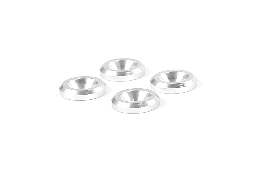 Four silver-coloured metal countersunk washers arranged on a white background.