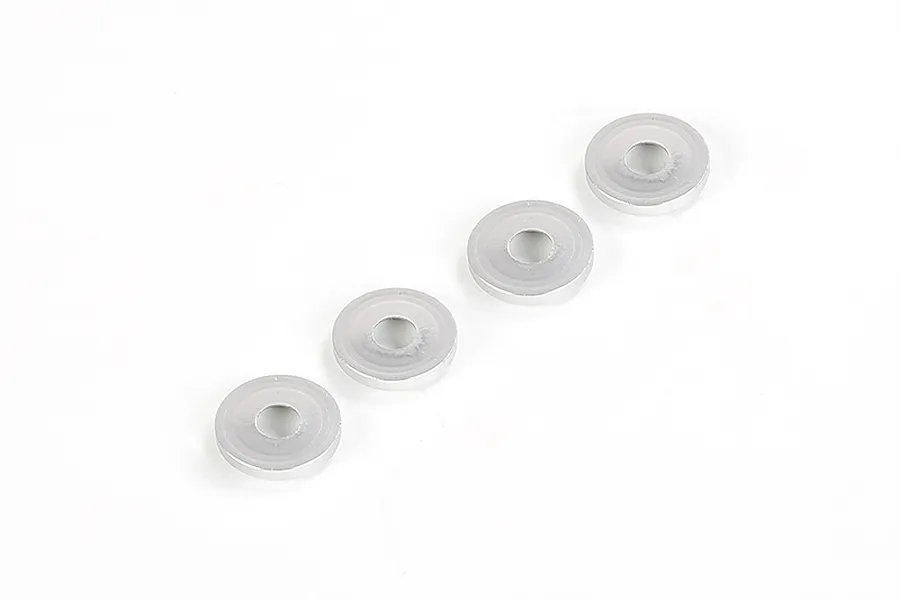 Four silver-coloured metal countersunk head gaskets arranged in a diagonal line on a white background.