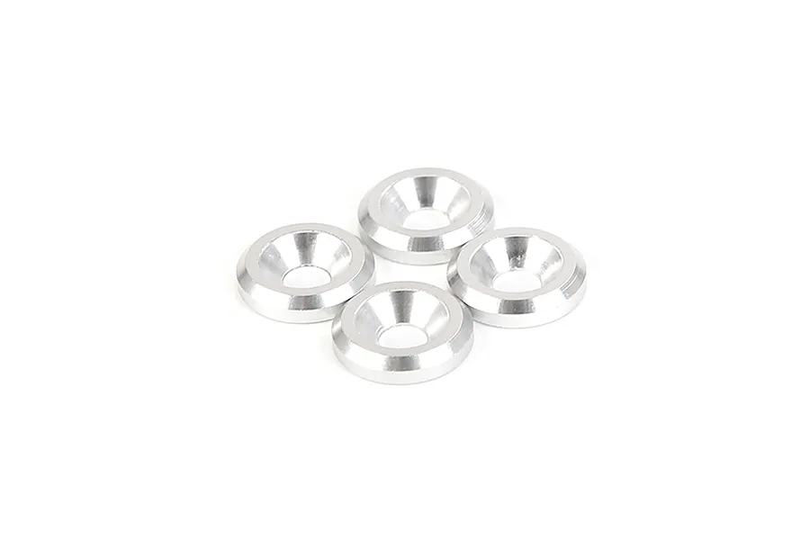 Four silver-coloured metal countersunk washers arranged in a cluster on a white background.