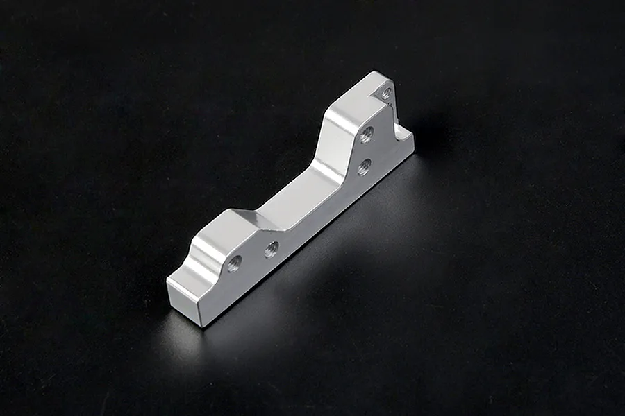 A silver Rovan aluminium engine mount for RC cars, featuring a machined metal design with multiple screw holes, set against a plain black background.
