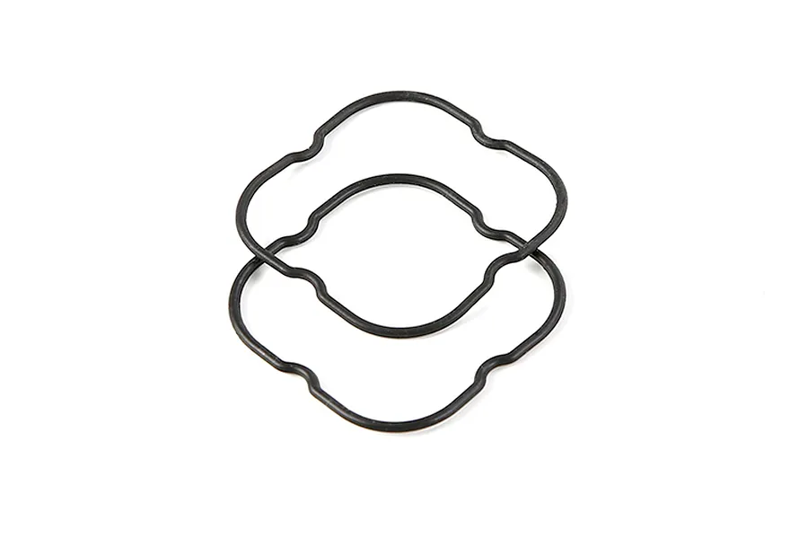 Two black rubber O-ring seals with a contoured, non-circular shape on a white background.