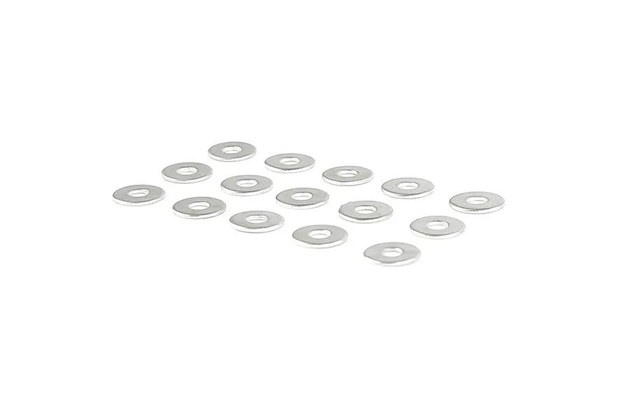 A collection of small silver metal washers arranged on a white background.