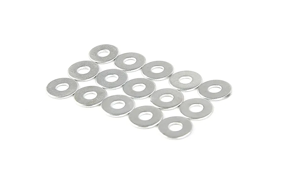 A collection of twelve small, round, silver-coloured metal washers arranged in a grid on a white background.
