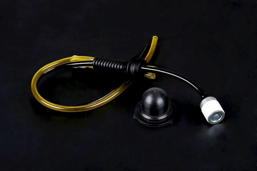 Rovan Baja fuel system kit including fuel tubing, a fuel filter, and a black rubber tank grommet and cap seal.