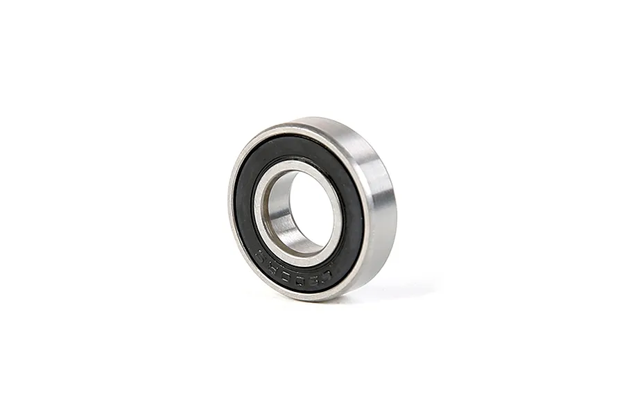 A single metal ball bearing with a black rubber seal, shown at an angle against a white background.