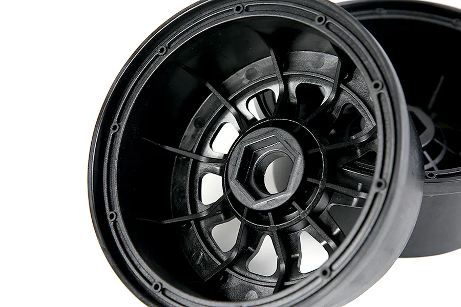 A black plastic RC car wheel hub with a hexagonal center mount, shown from an angled perspective against a white background.