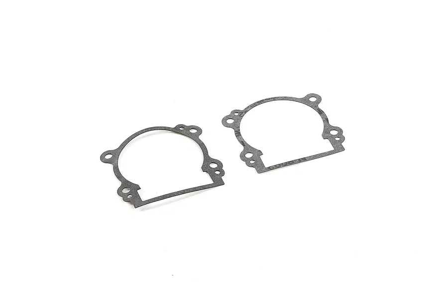 Two grey Rovan 45cc 2-stroke engine crankcase gaskets laid flat on a white surface.