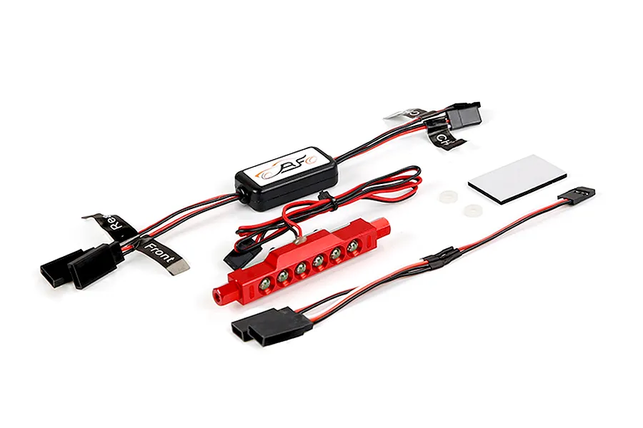 Rovan RC light controller kit with a red metal LED light bar, wiring harness, control module, and adhesive mounting pad on a white background.