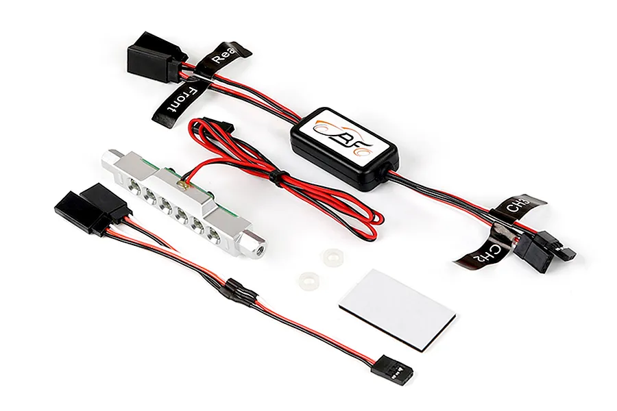 Rovan RC light controller kit featuring a silver LED light bar, control module, wiring harnesses with labels, and mounting hardware on a white background.