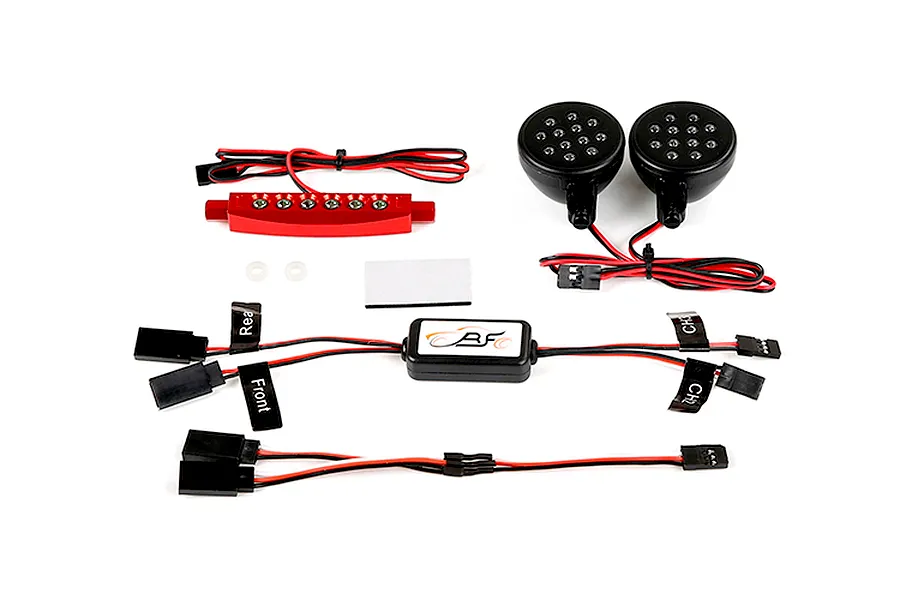 Rovan RC light controller kit including a central control module, two round LED headlights, a red rear light bar, and various wiring harnesses.