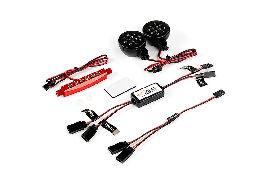 Rovan RC light controller kit including two round LED headlights, a red LED light bar, control module, and various wiring harnesses.