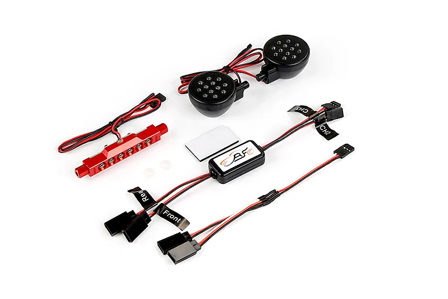 Rovan RC light controller kit including a control module, two round LED light pods, and a red LED light bar with wiring harnesses.
