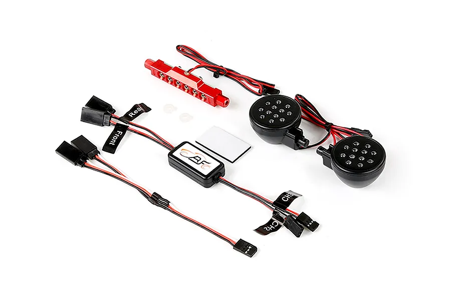 Rovan RC light controller kit including a red LED bar, two round black LED headlight units, a control module, and wiring harnesses on a white background.