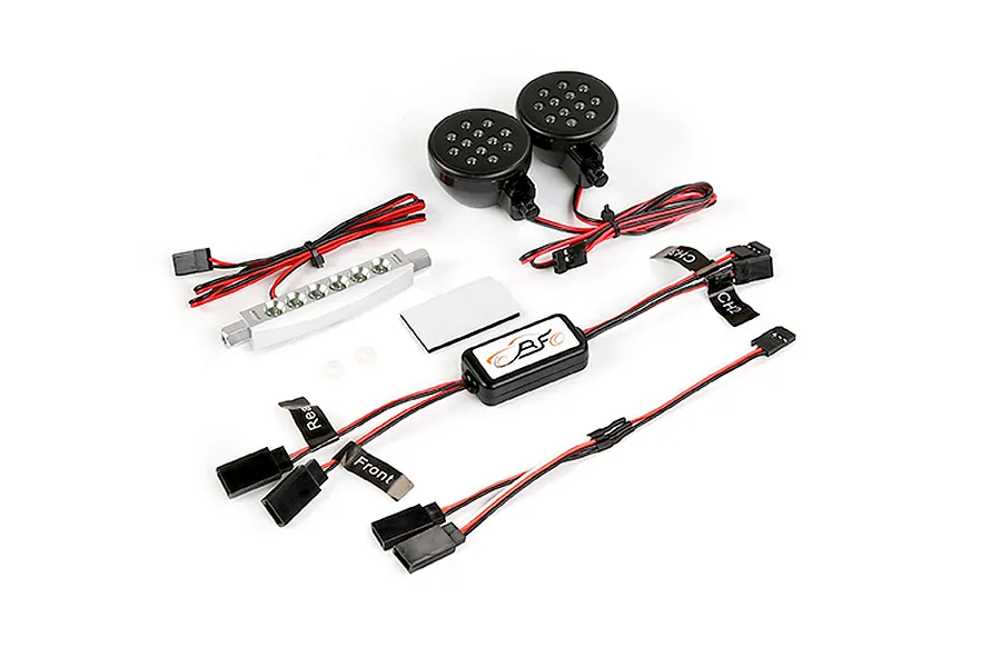 Rovan RC light controller kit including a central control module, two round LED light pods, and a silver LED light bar with wiring harnesses.