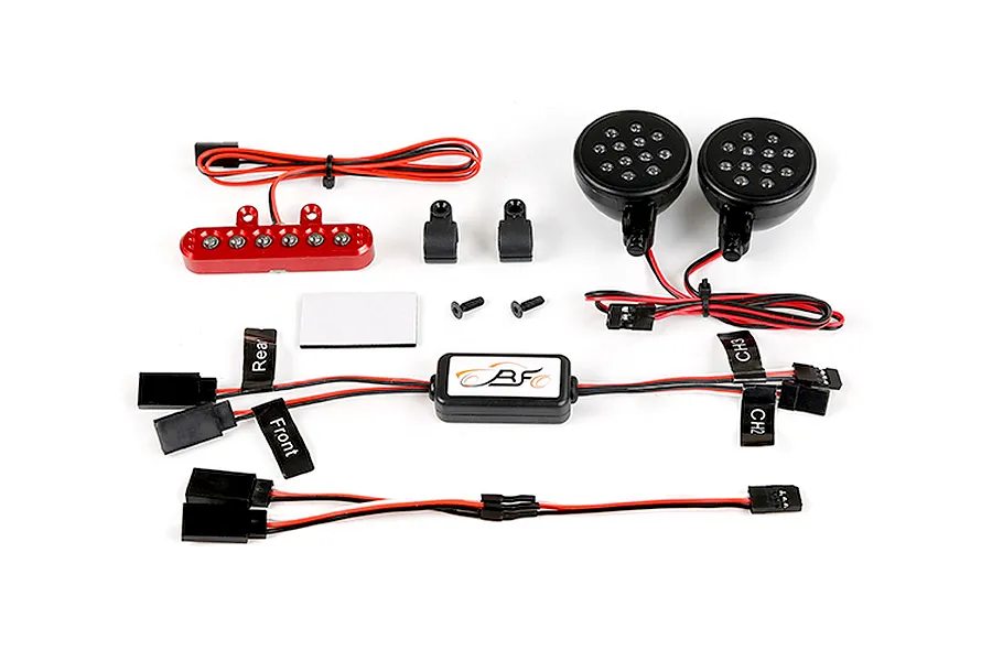 Rovan RC light controller kit including a red rear light bar, two round front LED headlights, a central control module, and various wiring harnesses.