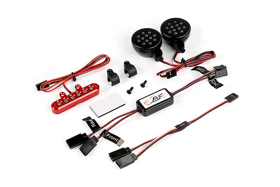 Rovan RC light controller kit including two round LED headlights, a red LED light bar, control module, and wiring harnesses on a white background.