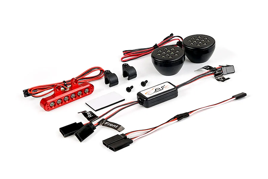 Rovan RC light controller kit including a red LED bar, two round black LED headlights, a control module, and mounting hardware on a white background.
