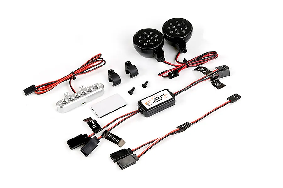 Rovan RC light controller kit including two round black LED headlights, a silver LED light bar, control module, wiring harnesses, and mounting hardware.