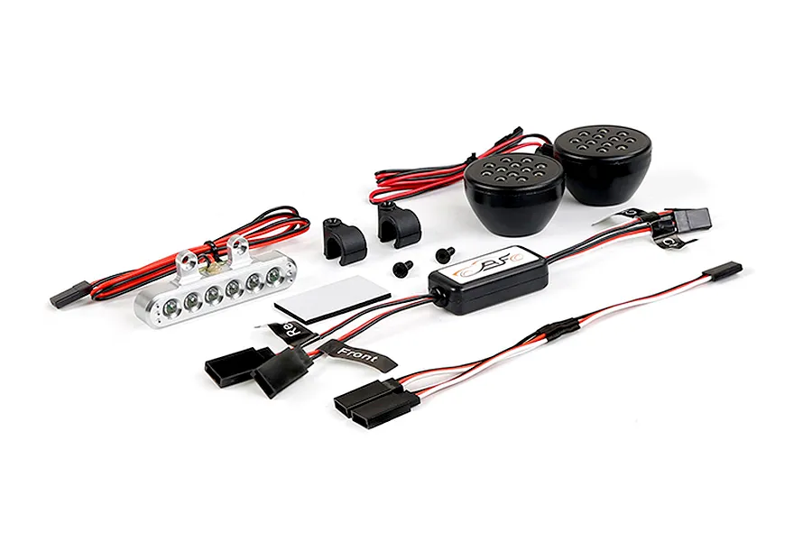 Rovan RC light controller kit including a silver LED light bar, two round black LED light pods, a control module, and wiring harnesses.