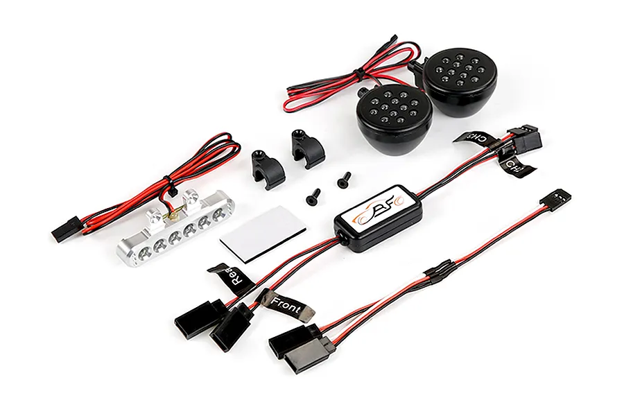 Rovan RC light controller kit including a silver LED light bar, two round black LED light pods, a control module, mounting brackets, and wiring harnesses.