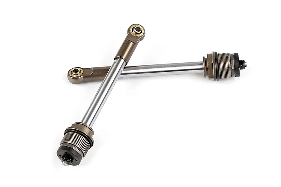 Two Rovan gun metal RC shock shafts with attached rod ends and threaded collars, isolated on a white background.