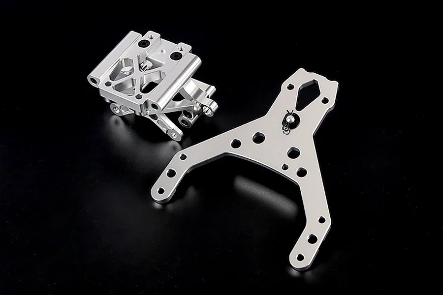 Rovan silver aluminium front bulkhead set including an upper plate for RC vehicles, shown on a plain black background.