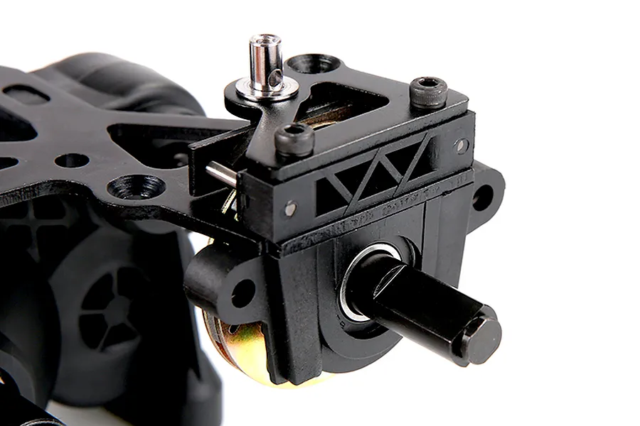 Close-up of a Rovan 1/5 scale RC Baja transmission assembly featuring a black plastic gearbox, metal brake components, and a drive shaft.