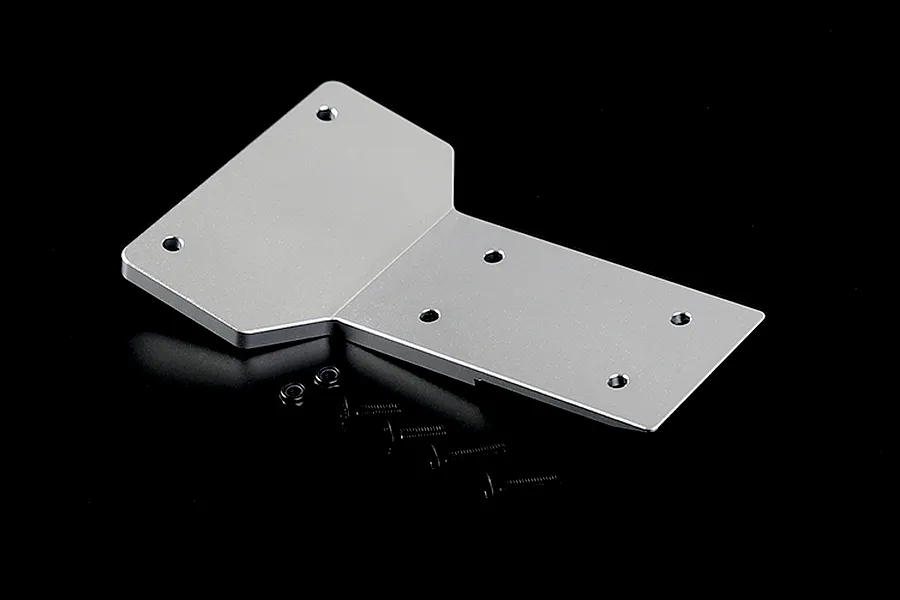 A silver aluminium front skid plate for an RC car with four black screws and two small nuts on a black background.