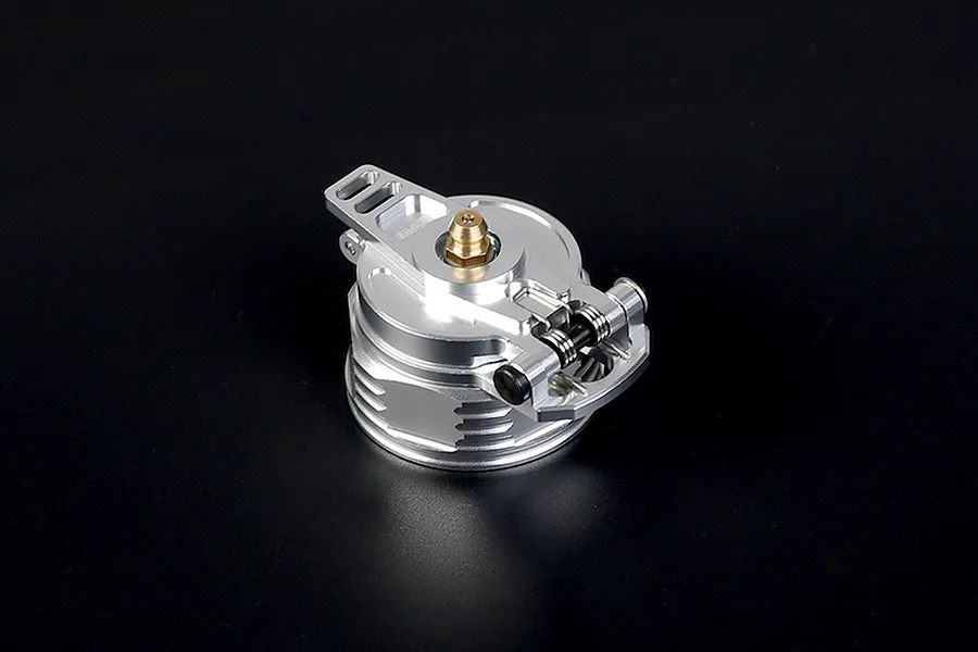 A silver Rovan aluminium leak-proof fuel tank cap for RC vehicles, featuring a hinged lever and a brass-coloured central fitting.