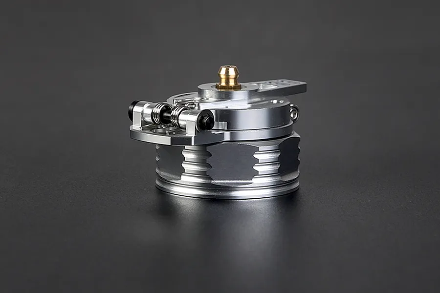 A silver Rovan aluminium leak-proof fuel tank cap for RC vehicles, featuring a spring-loaded hinge mechanism and a brass-coloured vent fitting.