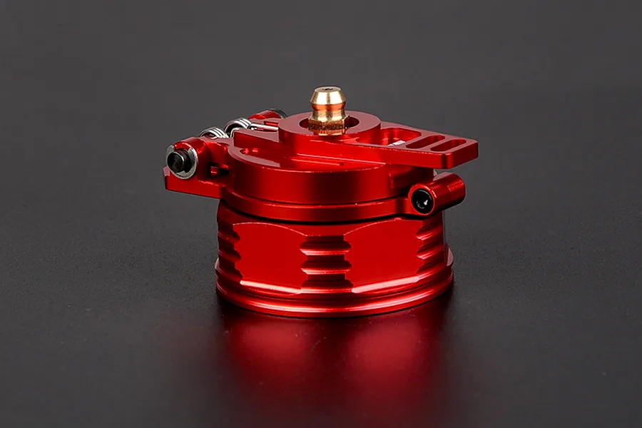 A red anodized aluminium fuel tank cap for RC vehicles, featuring a hinged design and a brass-coloured central fitting.
