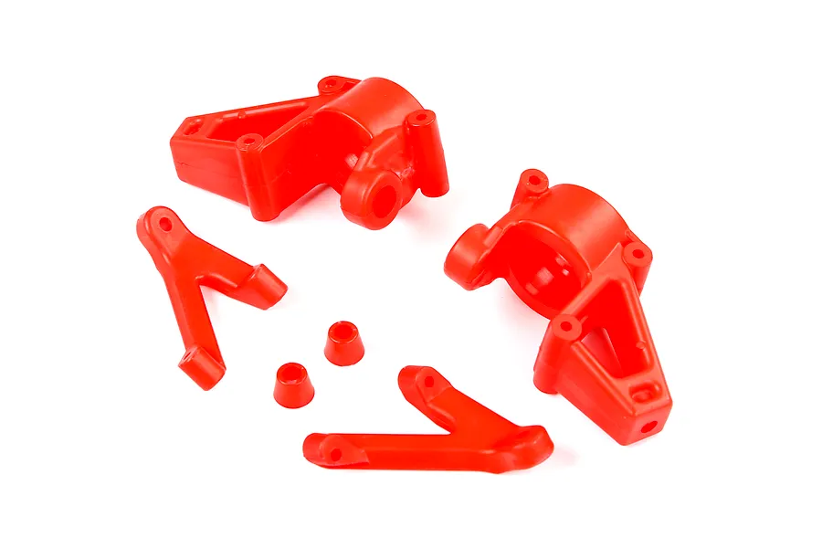 A set of bright red nylon RC car front steering hubs and suspension components on a white background.