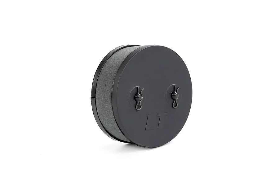 A black circular RC air filter assembly with a foam element and two R-clips on the front cover, marked with LT.