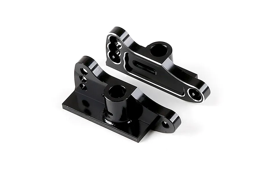 A pair of black anodized aluminium rear wing mounts for an RC car, featuring machined edges and multiple mounting holes.
