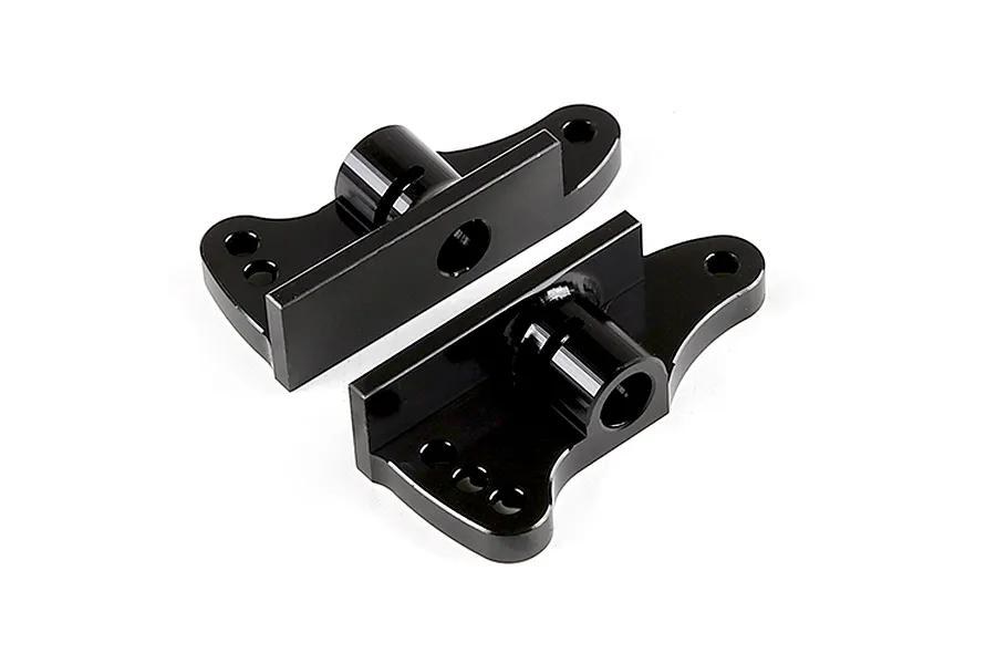 A pair of black anodized aluminium rear wing mounts for an RC car, shown from a high angle against a white background.