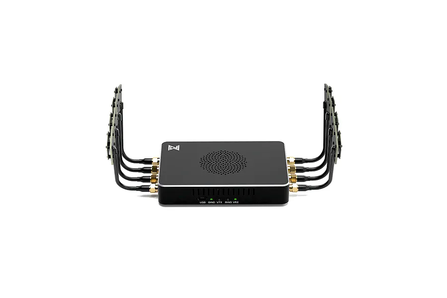 CaddxFPV Walksnail Avatar Video Repeater unit with four antennas on each side, black casing, and status indicator lights on a white background.