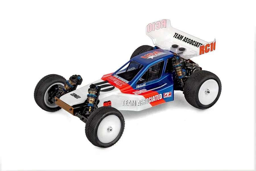 Studio product shot of a Team Associated RC10 1/10 scale electric RC buggy with blue, white, and red body graphics against a plain white background.