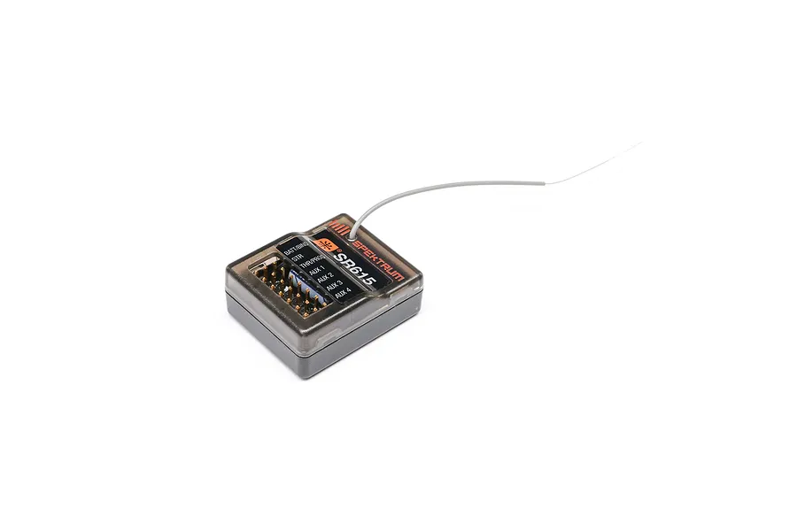 Spektrum SR615 6-channel RC receiver featuring a semi-transparent dark plastic case and a flexible grey antenna wire against a white background.