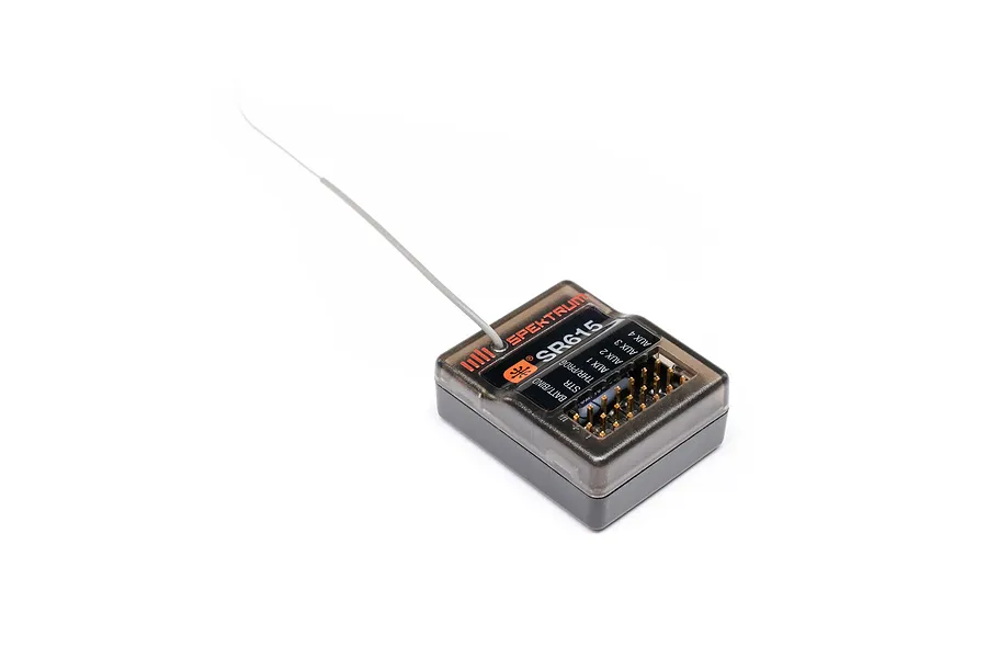 Spektrum SR615 2.4GHz 6-channel RC receiver in a dark translucent case with an attached wire antenna against a white background.