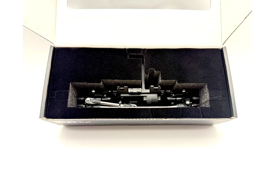 Reefs RC aluminium front portal axle set in black, securely packaged inside a custom foam-lined cardboard box.