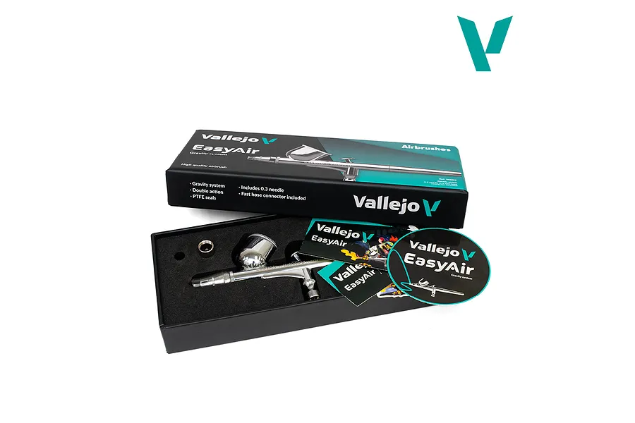 Vallejo Easyair Gravity System 0.3mm airbrush in an open black presentation box with promotional cards and stickers.