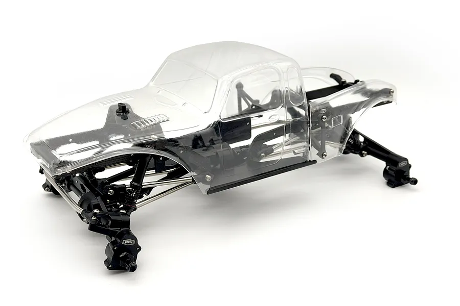 Reefs RC XP10 Plague Black Edition 1/10 scale rock crawler chassis kit with a clear unpainted body shell against a white background.