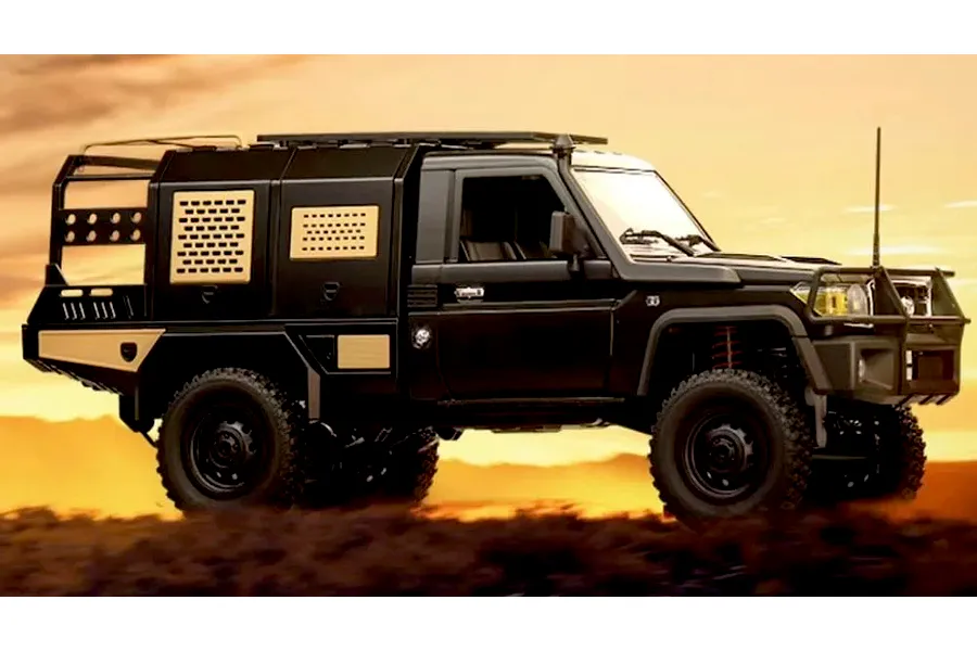 Black MN Model Toyota LC79 RC rock crawler truck parked on a dirt hill against a sunset sky background.