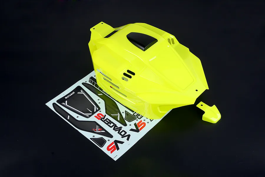 Bright yellow painted body shell for Rovan 1/5 V5 buggy, shown with an included sticker sheet on a dark background.